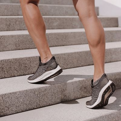 A person in mid-motion during a fluid cardio exercise.